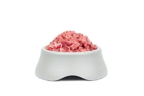 how much raw food to feed a puppy uk 2026